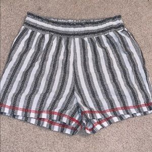 White and black striped shorts | red detailing